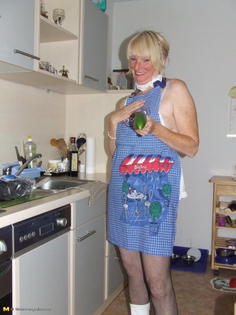 Naughty housewife gets frisky in the kitchen